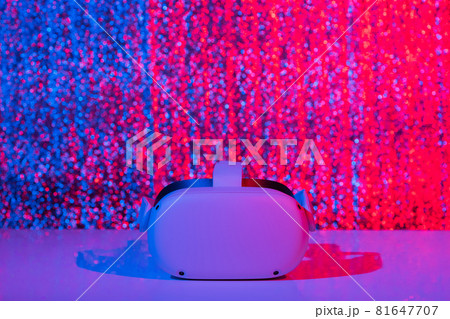 Virtual reality helmet on white background in neon light. VR technology concept. Virtual reality helmet on white background in neon light. VR technology concept. 81647707