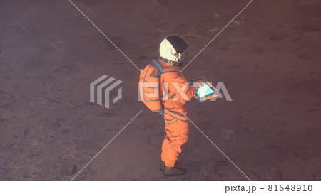 An astronaut is working at a computer next to his rover on an alien, unexplored desert planet. 3D Rendering 81648910