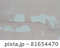 Pink cement wall background cracked and peeling paint 81654470