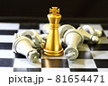 gold King chess surrounded by a number of fallen silver chess pieces , business strategy concept 81654471