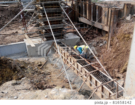 KUALA LUMPUR, MALAYSIA -APRIL 06, 2016: Ground beam form work constructed by workers at the construction site. Made from plywood and timber.  81658142