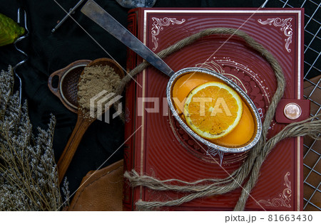 Orange cheese cake on beautiful background. One piece. Orange cheese cake on beautiful background. One piece. 81663430