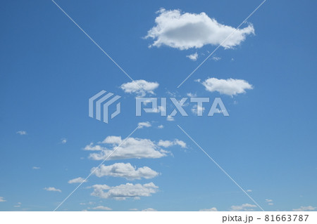 Small cumulus clouds against the blue sky. Background. 81663787