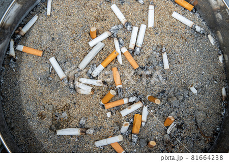 Cigarettes are then left in the ashtray in smoking zone area. Cigarettes are then left in the ashtray in smoking zone area. 81664238