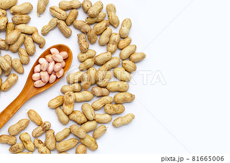 Raw peanuts on white background. Raw peanuts on white background. 81665006