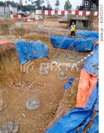 JOHOR, MALAYSIA -MARCH 29, 2016: Construction workers spraying the anti termite chemical treatment to the soil at the construction site.  81672257
