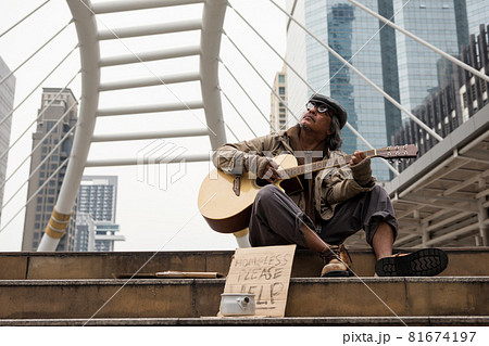 Old beggar sing and play flolk song guitar for money Old beggar sing and play flolk song guitar for money 81674197