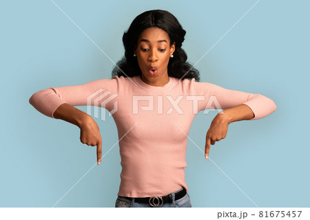 Look There. Excited Black Woman Pointing Down With Two Fingers 81675457