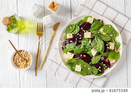 roasted beet salad with feta, spinach, pine nuts 81675589