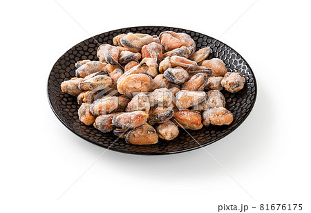 Frozen peeled mussel meat on an round black ceramic plate isolated on a white. Frozen peeled mussel meat on an round black ceramic plate isolated on a white. 81676175