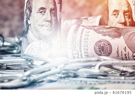 Pile of money, chain and bitcoin. Bitcoin and one hundred dollar banknotes with chain. Cryptocurrency in cyberspace as a system of payment. Crime, corruption concepts 81676195