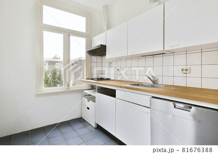 Beautiful and spacious kitchen in an elegant home 81676388