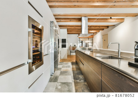 Beautiful and spacious kitchen in an elegant home 81678052
