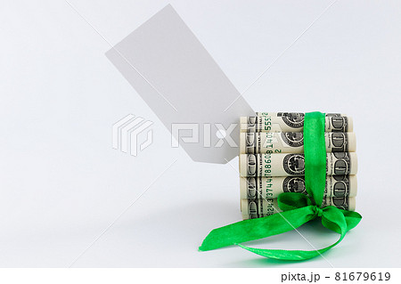 Banknotes of 100 dollars tied with green ribbon. Mock up. Banknotes of 100 dollars tied with green ribbon. Mock up. 81679619