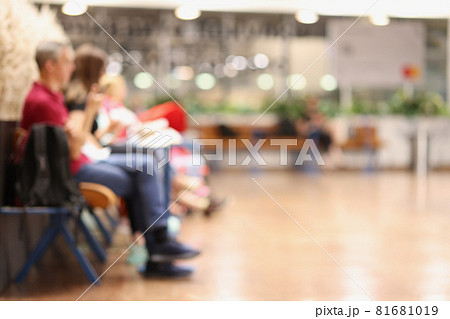 Abstract blur background of people or passengers seated in airport transport terminal Abstract blur background of people or passengers seated in airport transport terminal 81681019