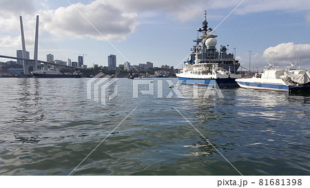 view from the embankment of Vladivostok to the ships and part of the city on a sunny day view from the embankment of Vladivostok to the ships and part of the city on a sunny day 81681398