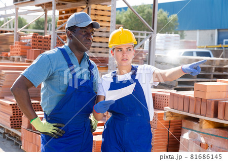 Man and woman in outdoor construction material storage Man and woman in outdoor construction material storage 81686145