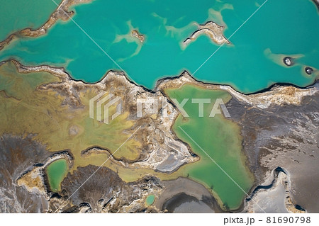 Drone view of the turquoise lake formed as a result of mining waste Drone view of the turquoise lake formed as a result of mining waste 81690798