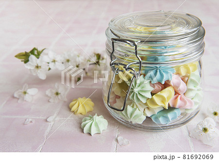 Small colorful meringues in the glass jar Small colorful meringues in the glass jar 81692069