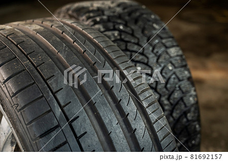 Winter studded and summer car tires. Change of wheels according to the season 81692157