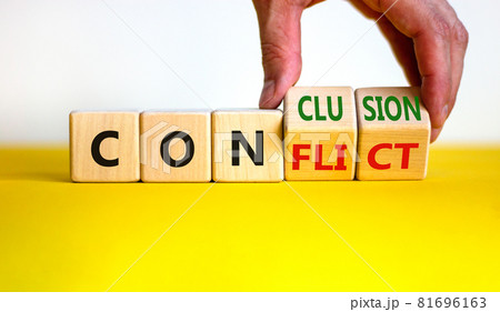Conflict or conclusion symbol. Businessman turns wooden cubes, changes the word 'conflict' to 'conclusion'. Beautiful yellow and white background, copy space. Business, conflict or conclusion concept. 81696163