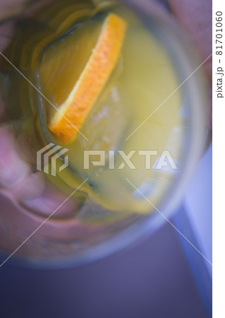 Orange soda in a crystal glass with a piece of natural orange 81701060