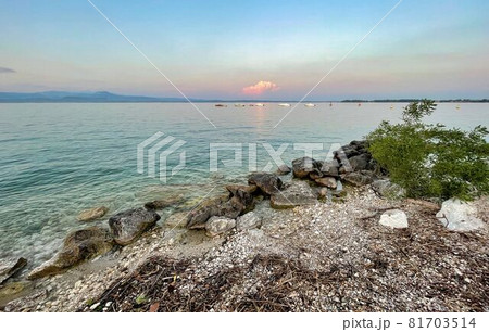 water of lake garda in italy surrounded by mountains 81703514