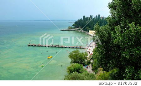 water of lake garda in italy surrounded by mountains water of lake garda in italy surrounded by mountains 81703532