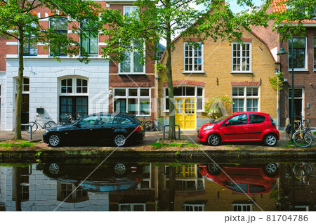Cars on canal embankment in street of Delft. Delft, Netherlands Cars on canal embankment in street of Delft. Delft, Netherlands 81704786