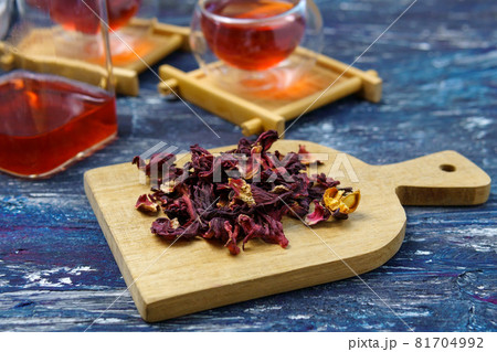 Hibiscus tea is fresh tea. Vitamin tea for colds and flu. On a dark background Hibiscus tea is fresh tea. Vitamin tea for colds and flu. On a dark background 81704992