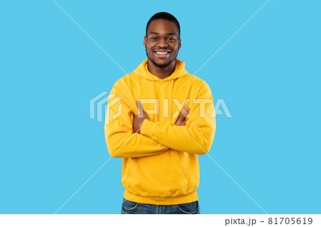 Happy African American Man Posing Crossing Hands On Blue Background 81705619