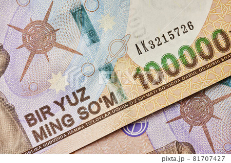 Macro shot of uzbek sum banknote. Pile of Uzbek sums. Uzbek currency money bill. A stack of one hundred thousand Uzbek sum. 100000 sum Macro shot of uzbek sum banknote. Pile of Uzbek sums. Uzbek currency money bill. A stack of one hundred thousand Uzbek sum. 100000 sum 81707427