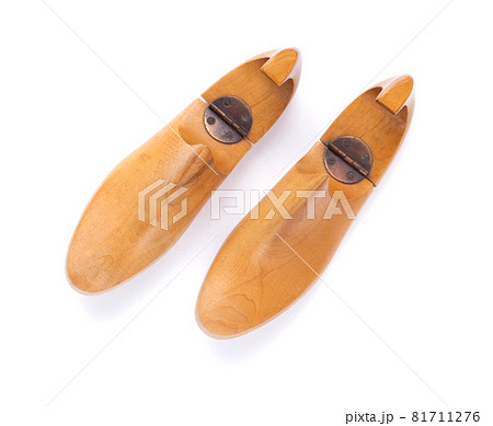 Wooden lasts shoes isolated at white background. Wood last for cobbler 81711276