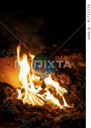 Globe in fire circle in abandoned space. Parallel to 2020 year Globe in fire circle in abandoned space. Parallel to 2020 year 81712318