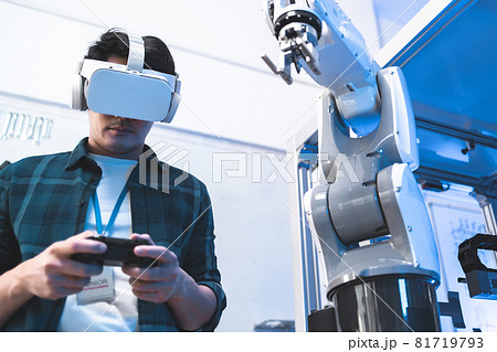 Male Engineers Maintenance Robot Arm at Lab. he are in a High Tech Research Laboratory with Modern Equipment. Technology and Innovation Concept.Professional Japanese Development Engineer is Testing an Male Engineers Maintenance Robot Arm at Lab. he are in a High Tech Research Laboratory with Modern Equipment. Technology and Innovation Concept.Professional Japanese Development Engineer is Testing an 81719793