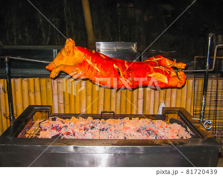 Roasted pig on the spit 81720439