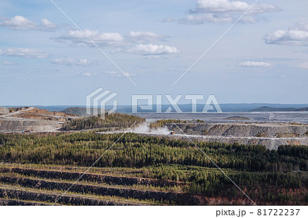 Aerial view industrial of opencast mining quarry with lots of machinery at wo Aerial view industrial of opencast mining quarry with lots of machinery at wo 81722237