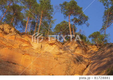 Peaceful landscape with red sandstone Erglu kliffs steep rocks in Gauja National Park in Valmiera area 81728881