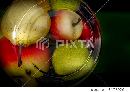 Preserved canned apples and pear in big glass jar 81729264