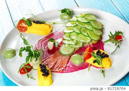 Fish dish - fried fish fillet and vegetables 81729704