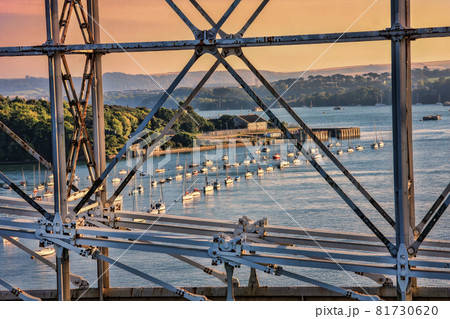 Construction of Royal Albert Bridge (railway) against sailboats on Tamar river between Devon and Cornwall, Plymouth area, England, UK Construction of Royal Albert Bridge (railway) against sailboats on Tamar river between Devon and Cornwall, Plymouth area, England, UK 81730620