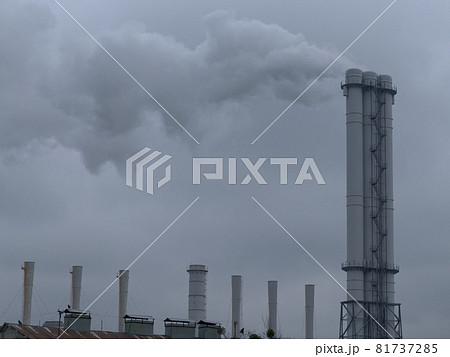 Smoke comes from industrial chimneys. The sky is covered with gray clouds. Environmental pollution. Smoke comes from industrial chimneys. The sky is covered with gray clouds. Environmental pollution. 81737285