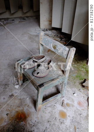 Small children's sandals in an abandoned kindergarten in Pripyat. Old children's shoes. 81738290