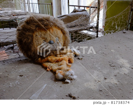 An old torn plush toy in an abandoned kindergarten. An abandoned kindergarten in Chernobyl. 81738374