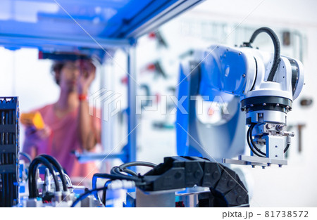 Asian male Engineers Maintenance Robot Arm at Lab. he are in a High Tech Research Laboratory with Modern Equipment. Technology and Innovation Concept.. 81738572
