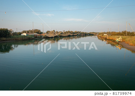 Panorama shot of fishing huts on river 81739974