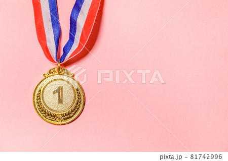 Simply flat lay design winner or champion gold trophy medal isolated on pink colorful background. Victory first place of competition. Winning or success concept. Top view copy space. Simply flat lay design winner or champion gold trophy medal isolated on pink colorful background. Victory first place of competition. Winning or success concept. Top view copy space. 81742996