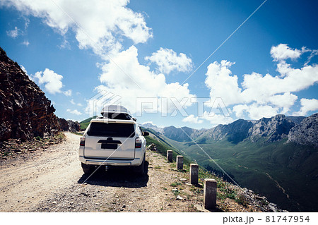 Driving off road car on high altitude mountain top 81747954