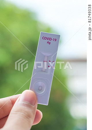 man holding Rapid Antigen Test kit with Negative result during swab COVID-19 testing. Coronavirus Self nasal or Home test, Lockdown and Home Isolation concept man holding Rapid Antigen Test kit with Negative result during swab COVID-19 testing. Coronavirus Self nasal or Home test, Lockdown and Home Isolation concept 81749338