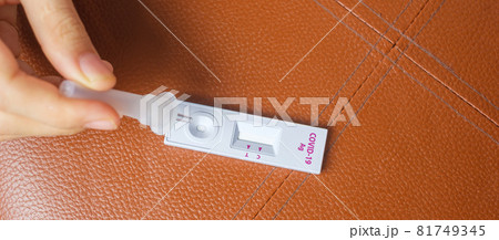 man swab COVID-19 testing by Rapid Antigen Test kit. Coronavirus Self nasal or Home test, Lockdown and Home Isolation concept man swab COVID-19 testing by Rapid Antigen Test kit. Coronavirus Self nasal or Home test, Lockdown and Home Isolation concept 81749345